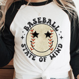 Baseball State Of Mind DTF Heat Transfer, displayed on a women's long sleeve t-shirt with a smiley face design with star eyes and baseball stitching details.