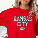 Kansas City Leopard DTF Heat Transfer, Red T-shirt with leopard print Kansas City and arrow graphic.