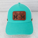 Baseball Mom Leather Hat Patch, turquoise baseball cap with a brown leather patch on the front that says 'Baseball Mom' with a baseball and heart design.