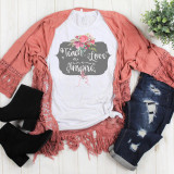Teacher Teach Love Inspire Floral Sublimation Transfer, a graphic T-shirt with floral design and inspirational text laid out with accessories including black boots, ripped jeans, and a pink lace cardigan.