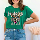 Def Proud Autism Mama DTF Heat Transfer, African leopard illustration with colorful rainbow sunglasses, on a green t-shirt worn by a smiling woman.