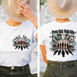 This DTF Heat Transfer, graphic design showing silhouettes of women walking in desert landscape with cacti, sunset background, and decorative text.