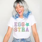 Eggstra Chenille 'look' DTF Heat Transfer, colorful embroidered style text on a woman's white t-shirt creating a playful and vibrant design.