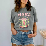 Mama Skateboard Drink DTF Heat Transfer, woman wearing a gray T-shirt with a colorful graphic design of a skateboard, a drink, and decorative elements.