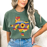 Serape Sunflower Texas DTF Heat Transfer, colorful design of sunflowers within the outline of Texas on a woman's green T-shirt.