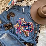 Bud And Sissy DTF Heat Transfer, colorful graphic T-shirt featuring a Texas-shaped design with leopard print and the words 'Bud & Sissy', surrounded by accessories like earrings, bracelets, a hat, and decorative items.