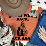 Guess Who's Back Black Ink DTF Heat Transfer, clothing with religious graphic and text laid out with accessories and shoes.