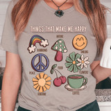 Things That Make Me Happy DTF Heat Transfer T-shirt with colorful illustrations of rainbows, nature, smiling face, peace symbol, flowers, food, sunshine, and coffee.