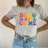 Drag Is Not A Crime DTF Heat Transfer, colorful text design on a gray t-shirt.