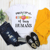 Principal of Tiny Humans Back To School Sublimation Transfer, white T-shirt with colorful apple, pencil, and school-themed design for kids.