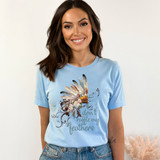 Don't Ruffle My Feathers DTF Heat Transfer, a design featuring feathers and floral accents with the phrase "don't ruffle my feathers" on a light blue t-shirt.