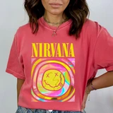 Nirvana T-shirt, digital print of a colorful smiley face with tongue out, featuring the Nirvana band name in bold yellow letters, showcasing DTF heat transfer design on a pink cotton T-shirt.