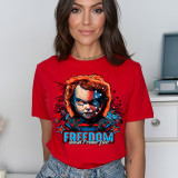 Freedom Doesn't Come Free DTF Heat Transfer, graphic design of a fierce doll with a patriotic American flag theme on a red t-shirt.