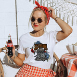 Let Freedom Ring Bell BLACK DTF Heat Transfer, image of a woman wearing a white t-shirt with a bell and floral design, and the text 'Let Freedom Ring' printed on it.