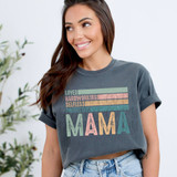 Loved Hardworking Selfless Protective Mama DTF Heat Transfer, in colorful distressed text on a dark gray T-shirt worn by a smiling woman.