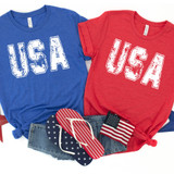 USA Distressed DTF Heat Transfer, image of two casual T-shirts with USA design, one blue and one red, along with American flag-themed accessories.