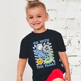 Go With The Float Blue DTF Heat Transfer, a colorful cartoon graphic featuring a shark, a snake, and a smiling sun on a black children's T-shirt.