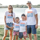 American Mini Checkered DTF Heat Transfer, family wearing matching patriotic themed t-shirts by a lake.