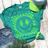 Checkered Happy Face NEON GREEN Screen Print Heat Transfer, bright neon green smiling face with lightning bolt eyes on a teal t-shirt with checkered background.
