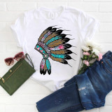 Watercolor and Leopard Print Headdress Sublimation Transfer, colorful feathered headdress design on a white t-shirt with pink, blue, black, and gold accents.