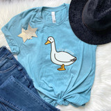 Silly Goose DTF Heat Transfer, cartoon goose graphic printed on a light blue T-shirt with the text 'silly goose'.