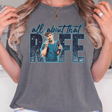 All About That RIFE DTF Heat Transfer, a graphic t-shirt featuring a person holding a microphone with a space-themed background and bold lettering.