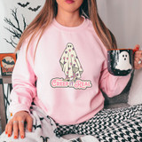 Creep It Real DTF Heat Transfer, woman wearing a pink sweatshirt with a ghost figure covered with a blanket decorated with hearts and the text 'Creep It Real' printed on it.