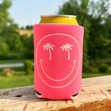 Happy Face Palm Trees White Pocket Screen Print Heat Transfer, pink can koozie with a white smiling face design featuring palm trees for eyes, designed to insulate cans.