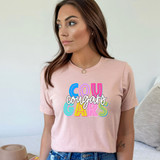 Cougars Colorful DTF Heat Transfer, vibrant multicolor design with the words 'Cougars Garts' on a woman wearing a pink t-shirt.