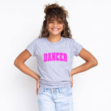 Dancer DTF Heat Transfer, pink text on a girl wearing a gray T-shirt.