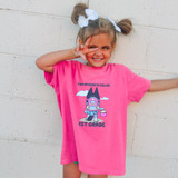 This Episode Is Called 1st Grade PINK DTF Heat Transfer, a pink T-shirt with a cartoon illustration of a black dog with a backpack, clouds, and text design.