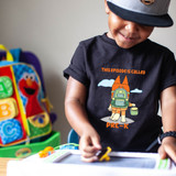 This Episode Is Called Pre-K Green DTF Heat Transfer, a colorful cartoon graphic of a dog with a backpack and suitcase, with clouds and the text "This episode is called Pre-K" on a child's black t-shirt.