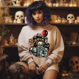 Spooky Clown DTF Heat Transfer, Halloween-themed clown design with a haunted house, red balloon, skulls, and creepy clown face on a sweatshirt.