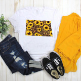 North Dakota Leopard Sunflower Sublimation Transfer, a vibrant fabric design featuring combined sunflower and leopard print patterns on a white T-shirt.