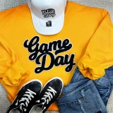 No Sport Black Game Day Chenille Patch, embroidered black and white patch on a yellow sweatshirt.
