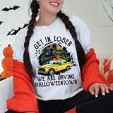 Get In Loser We Are Saving HT DTF Heat Transfer, Halloween-themed graphic of a yellow taxi cab with horror elements and Halloween decorations.