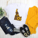 Idaho Leopard Sunflower Sublimation Transfer, a T-shirt with a unique design of the Idaho outline filled with leopard spots, sunflowers, and sunflower patterns.