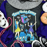 Easy Bake Coven Screen Print Heat Transfer, black T-shirt with colorful witch-themed design featuring children and Halloween elements.