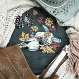 Fall Bull Skull Screen Print Heat Transfer, featuring a white bull skull with colorful flowers and autumn leaves on a dark background.