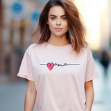Mama DTF Heat Transfer, a pink heart graphic and script text on a woman's white T-shirt.