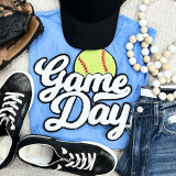 Softball White Game Day Chenille Patch, embroidered patch with a softball and the words 'Game Day' on a blue T-shirt surrounded by sneakers, a black cap, a beaded necklace, and denim jeans.