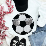 Sequins Soccer Patch Chenille Patch, decorative soccer ball patch with black, white, and silver sequins, on a flat lay of casual apparel and accessories including jeans, sneakers, a baseball cap, and a striped ribbon.