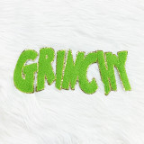 Grinchy Chenille Patch, green and yellow chenille patch with the word 'GRINCHY' in bold, textured letters on a white furry background.