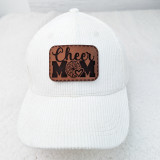 Cheer Mom Leather Hat Patch, white baseball cap with brown leather patch featuring cheerleader pom-poms, heart, and text design.