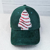 Mini Snack Cake Sequin Patch, sewn on a green corduroy baseball cap with a Christmas tree design