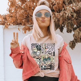 Horror Collage DTF Heat Transfer, colorful Halloween themed graphic T-shirt worn by a young woman outdoors