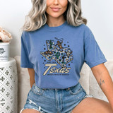 Texas DTF Heat Transfer, colorful illustration of the state of Texas with a cowboy, cacti, and stars on a blue t-shirt.