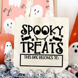 Spooky Treats DTF Heat Transfer, Halloween-themed tote bag with spooky face and candy design in black on a cream background, perfect for Halloween treat bags.