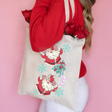Pink Candy Cane Santa DTF Heat Transfer, tote bag with Christmas Santa Claus and holiday decorations.