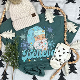 Blue Believe DTF Heat Transfer, a colorful cartoon Santa Claus with the word Believe on a teal shirt surrounded by snowflakes and festive decorations.
